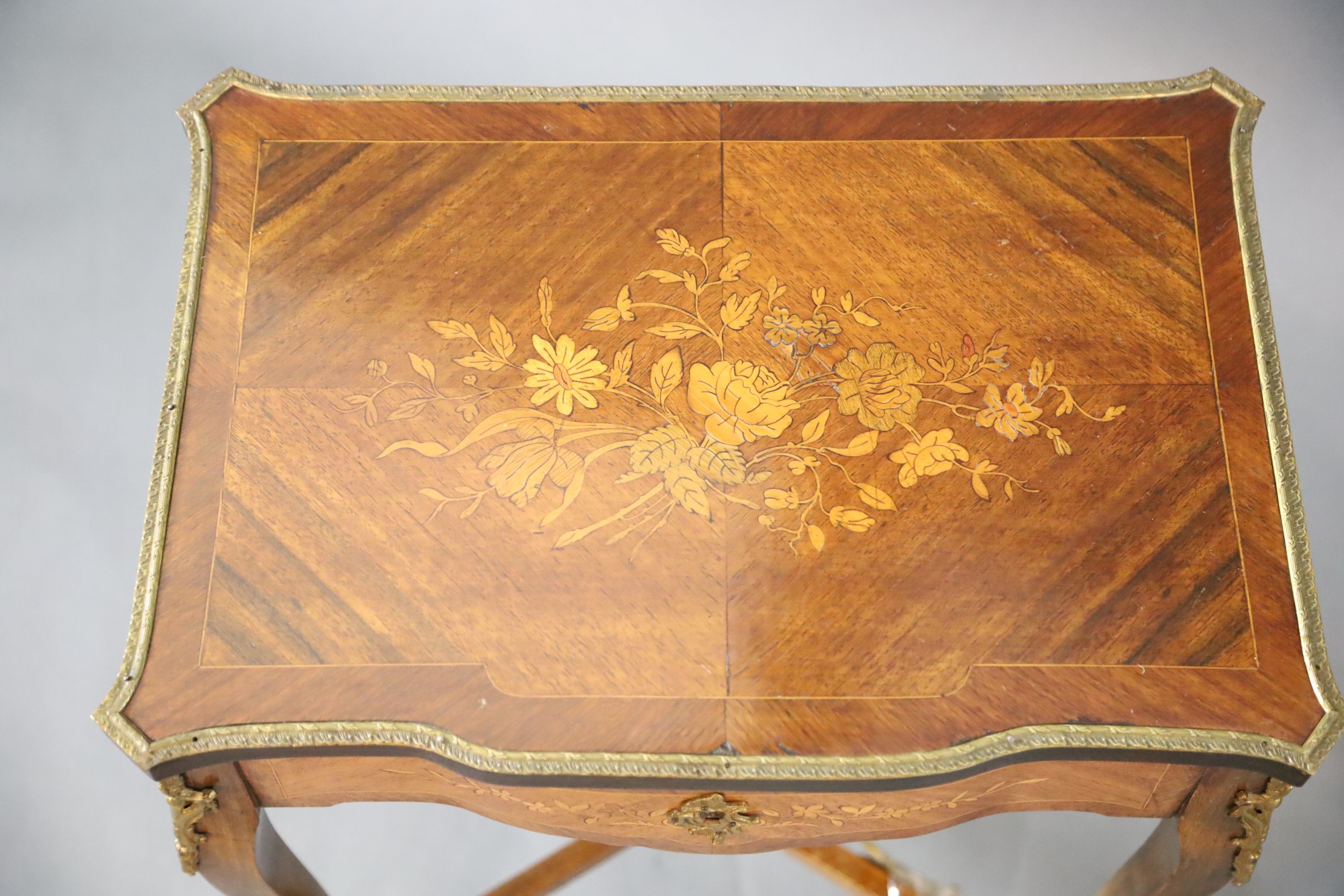 A pair of Louis XVI style ormolu mounted marquetry work tables, W.1ft 9in. D.1ft 3in. H.2ft 6in.